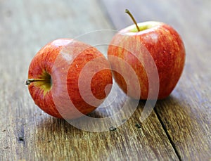Red apple fruit on wood