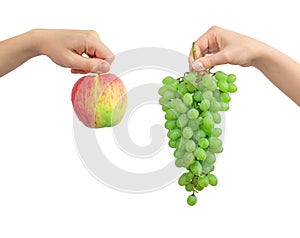 Red apple and green grape in hands, mix fruits isolated on a white background photo