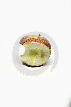 Red apple with green leaf missing a bite on a white background.