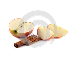 red apple half with slices and cinnamon