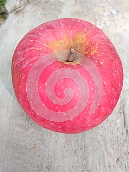 Red apple has a white spot on the skin surface