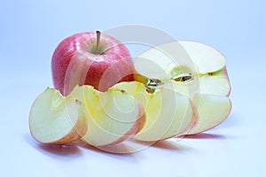 Red apple with leaf and slice