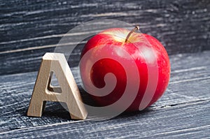 Red apple and letter A. The concept of primary education. Apple for the teacher. Sadik, school, college, university, educational i