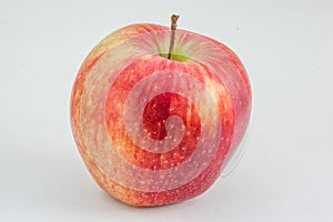 Red apple on a light gray background. Organic fruit, healthy eating, diet, lifestyle concept, treatment choice concept