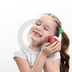 Red apple and little girl, portrait of a child on a white background