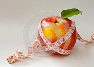 Red apple and measure tape