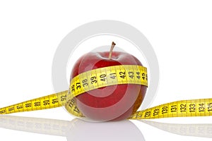 Red apple with measure tape