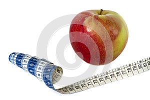 Red apple, measure tape isolated on white