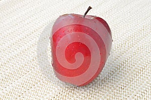 Red apple on napery