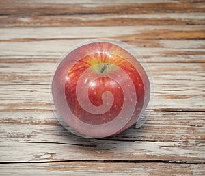 Red apple on an old table
