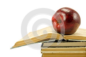 Red apple on open book