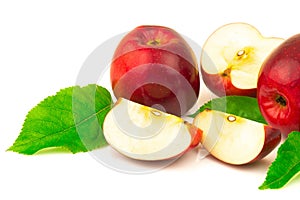 Red apple with slices and green leaves