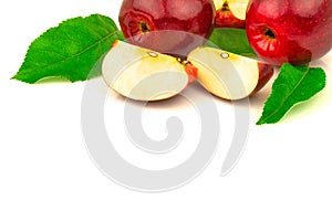 Red apple with slices and green leaves