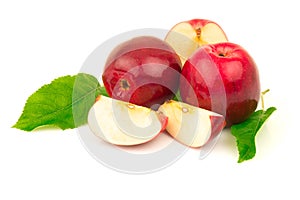 Red apple with slices and green leaves