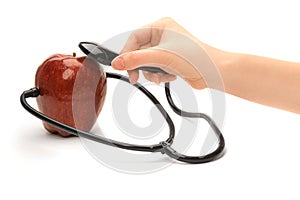A red apple and a stethoscope