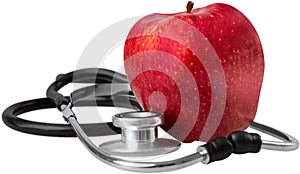 Red apple and a stethoscope on white background