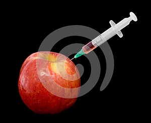 Red apple with a syringe