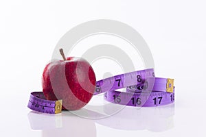 Red apple with tape measure