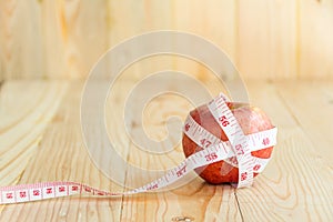 Red apple and Tape Measure.Healthy food