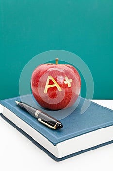 Red apple and Textbook