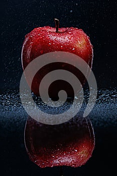 Red apple with water drops