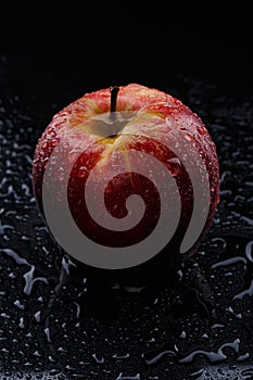 Red apple with water drops