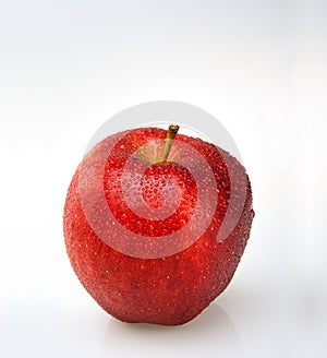 Red apple with water drops