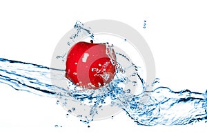 Red apple and water splash isolated
