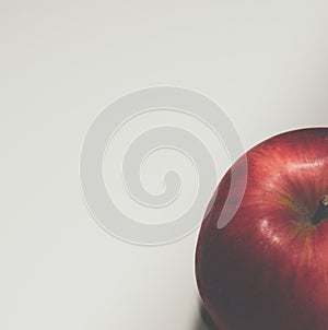 Red apple on a white background top view