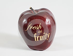 Red apple with the words - fresh and fruity -