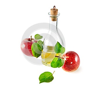 Red apples and apple cider vinegar isolated on white.