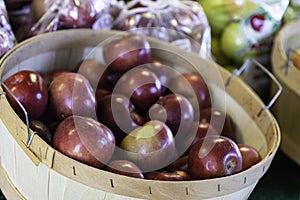 Red apples in basket at farmers market