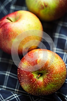 Red apples on blue textile