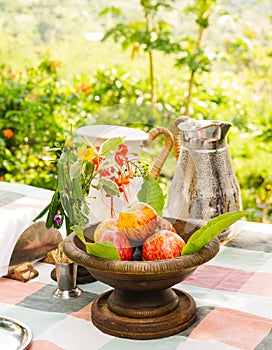 Red apples in copper bowl on table