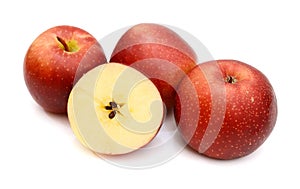 Sliced Red apples with green leaves isolated on white background.