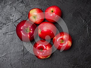 Red apples. Several fruits on a black background. Studio photography