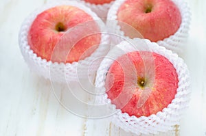 Red Apples on white wooden table