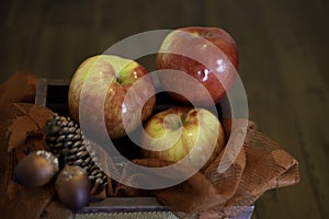 Red of apples in a wooden basket