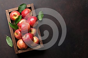 Red apples in wooden box