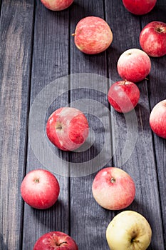 Red apples on wooden table