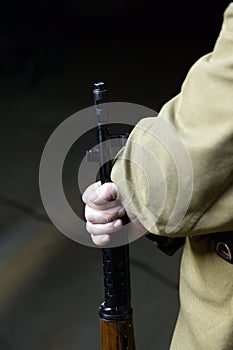 A Red Army soldier holds a Tokarev self-loading rifle in his hand