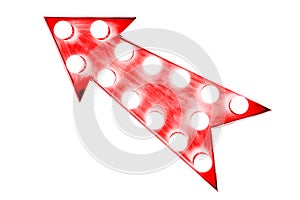 Red arrow as vintage bright and colourful illuminated metallic display arrow sign with glowing light bulbs