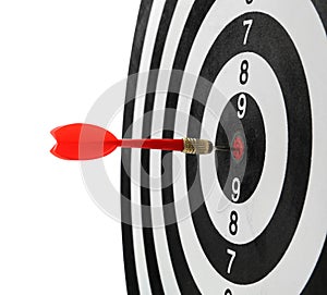 Red arrow hitting target on dart board