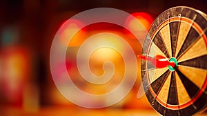 Red arrow hitting target on dart board on a blurred background