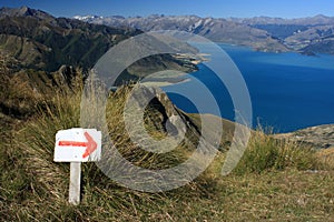 Red arrow marker showing direction above lake Hawea