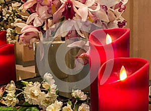 Red Artificial Candles at The Corner with Group of Variety Flowers used as Vintage Style Decoration in Luxury Bedroom