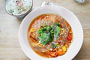 Red asian curry with seafood, bowl with rice