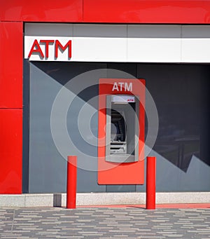 Red ATM in a wall