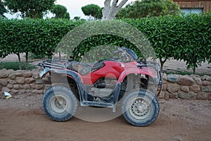 Red ATV in the park. Dahab, South Sinai Governorate, Egypt