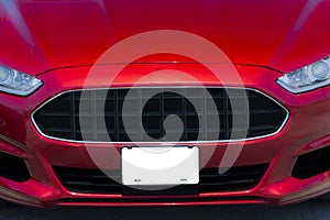 Red automobile With Blank White Front License Plate Copy Space
